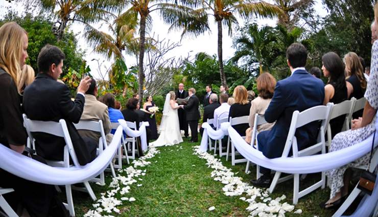 Daytime ceremony outdoors with guests